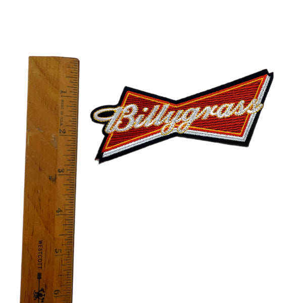 Billygrass logo with a ruler for scale on a white background